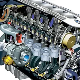 Przekrój silnika BMW M57 z turbosprężarką i widocznymi tłokami, zaworami i paskami napędowymi.